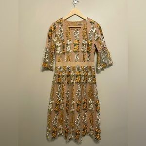 Boutique cream dress with embroidered floral detail